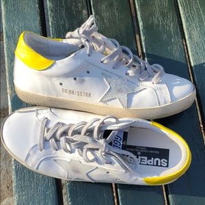 White and yellow Golden Goose sneakers